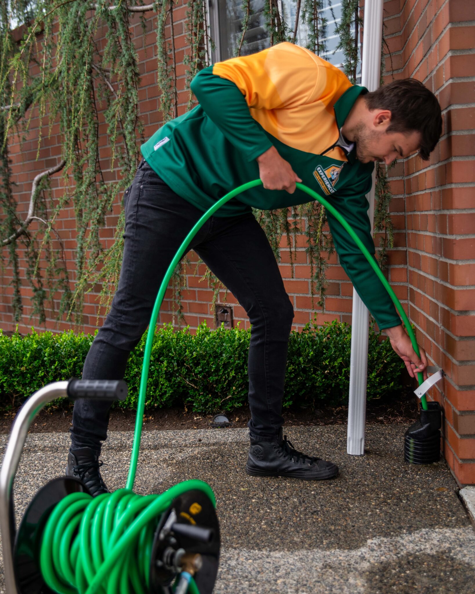 a guy working on hydro jetting a hole